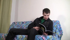 Marvelous twink enjoys jerking off on his comfortable couch. 
