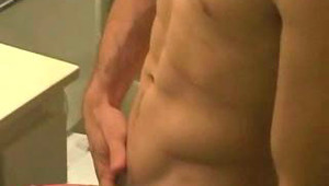 Horny teen jerking his uncut meat off on a grey bed ! 